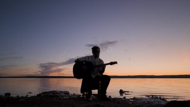 guitarra tocando acordes en un paisaje